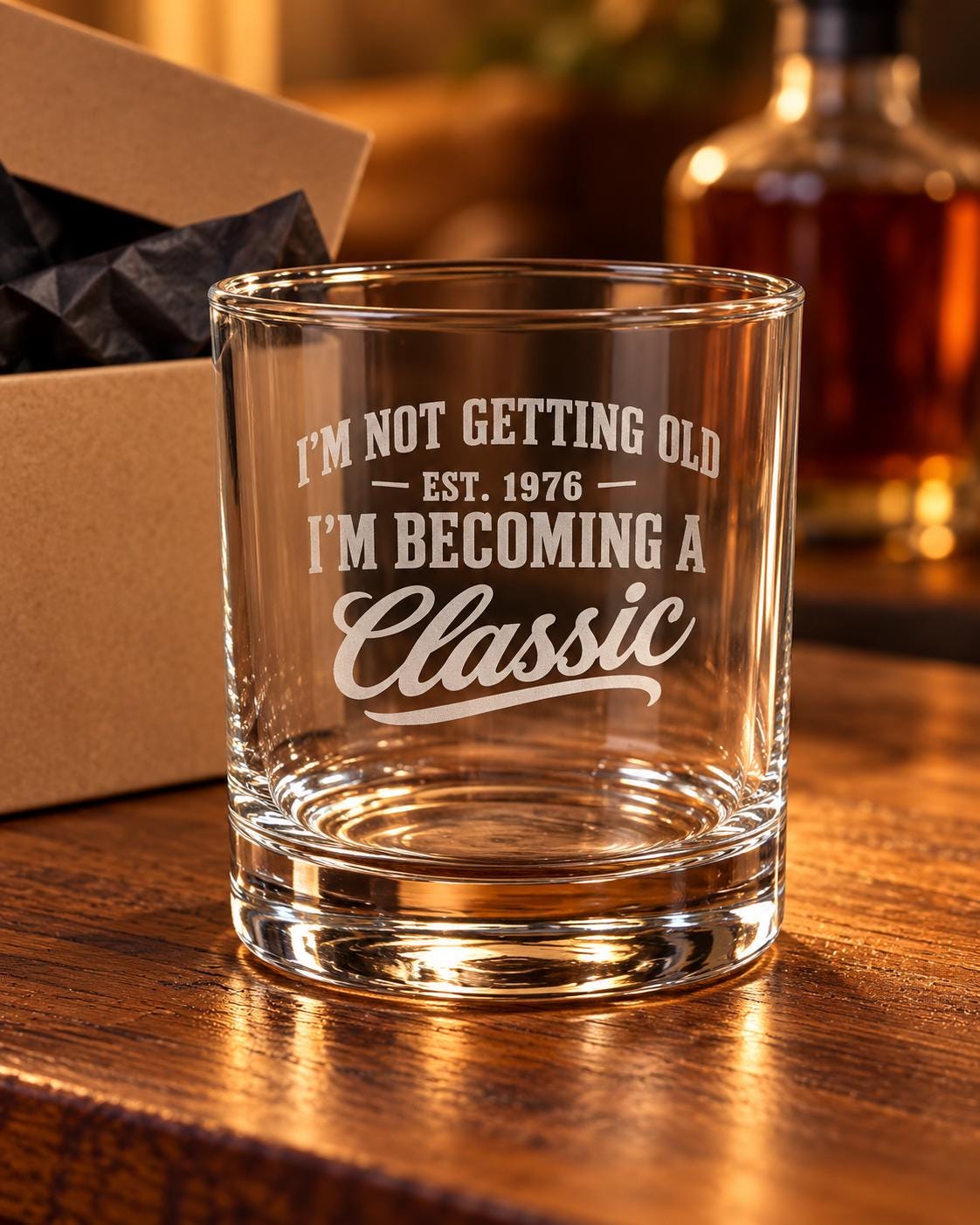 I'm Not Getting Old I'm Becoming a Classic Whiskey Glass - glass on a wooden bar next to a gift box