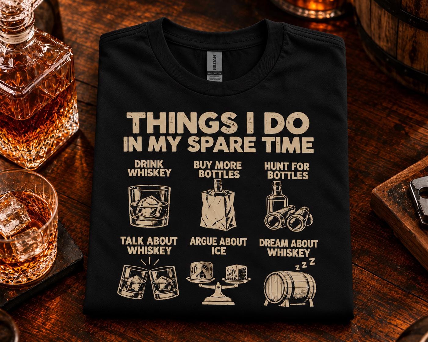 Things I Do In My Spare Time Whiskey T-Shirt - black t-shirt folded on a bar next to a decanter and a glass of whiskey