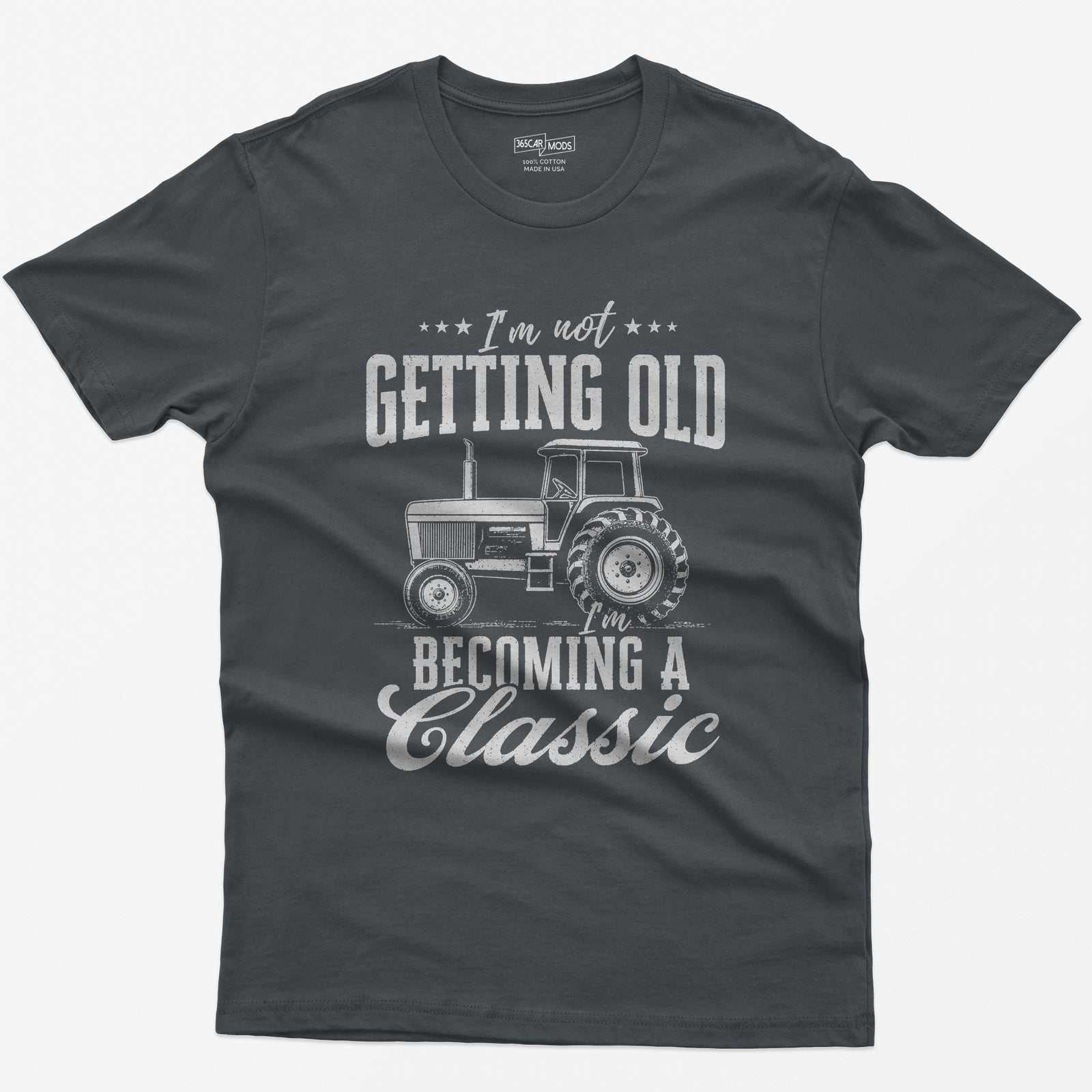 Charcoal t-shirt with I'm Not Getting Old I'm Becoming a Classic in distressed white print around a vintage cab tractor