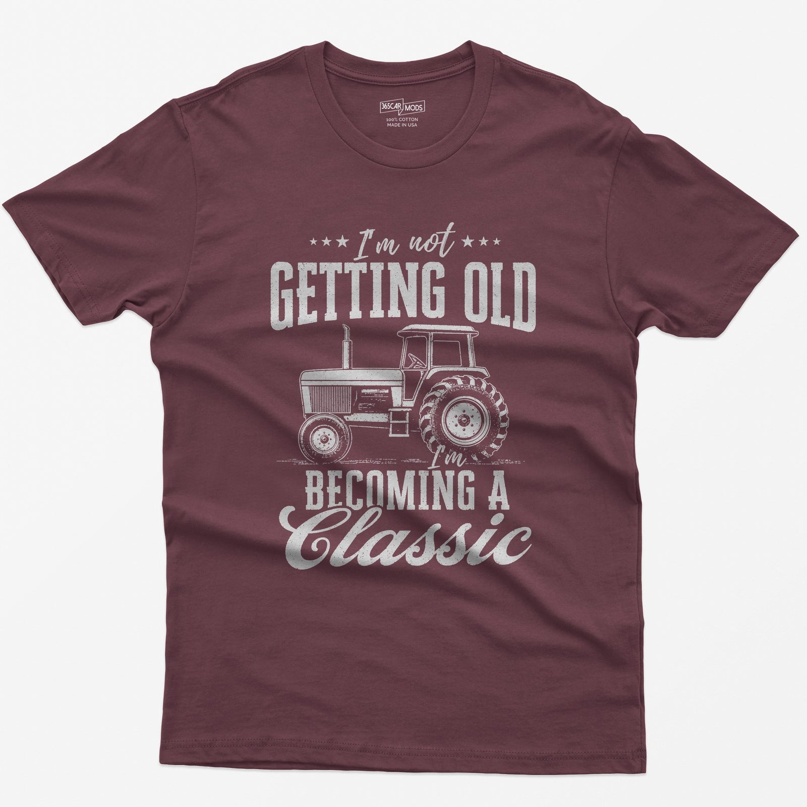 Maroon t-shirt with I'm Not Getting Old I'm Becoming a Classic in distressed white print around a vintage cab tractor