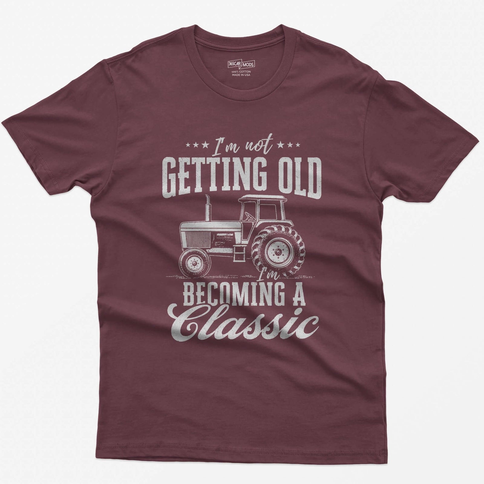 Maroon t-shirt with I'm Not Getting Old I'm Becoming a Classic in distressed white print around a vintage cab tractor