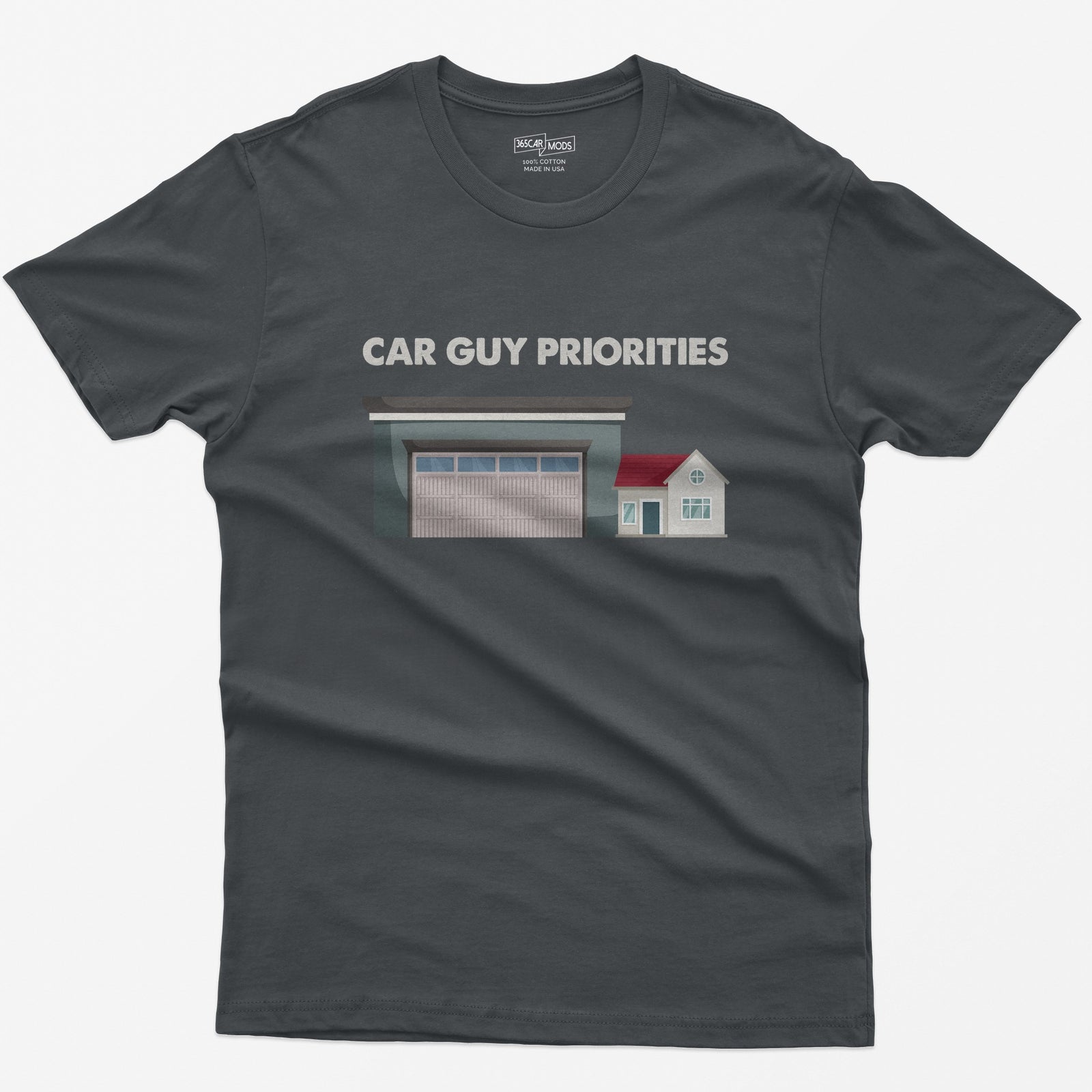 Charcoal t-shirt with Car Guy Priorities text above a huge garage next to a tiny house illustration