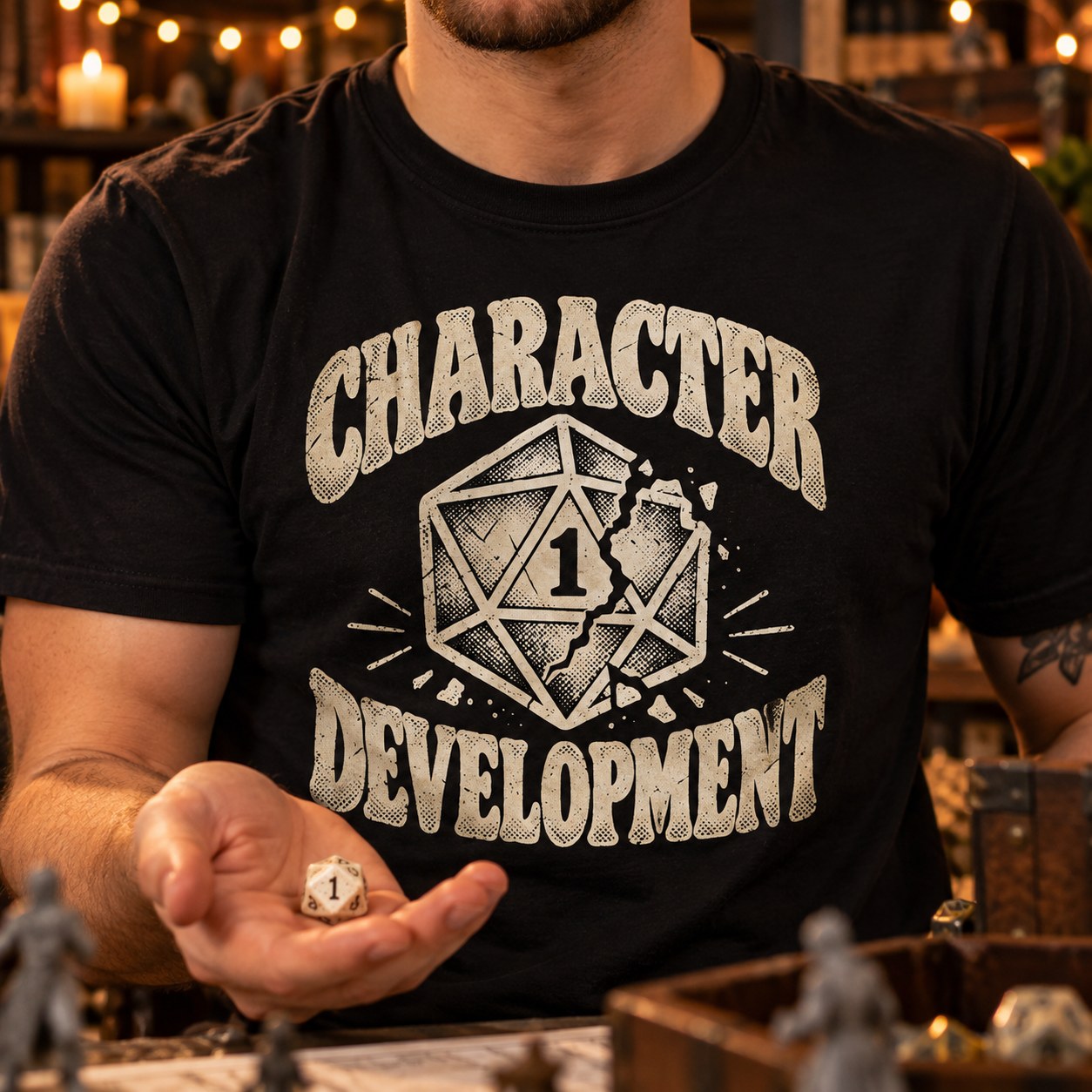 Character Development T-Shirt | Nat 1 D20 Tabletop RPG Tee worn by a man holding a d20 die at a game night table.