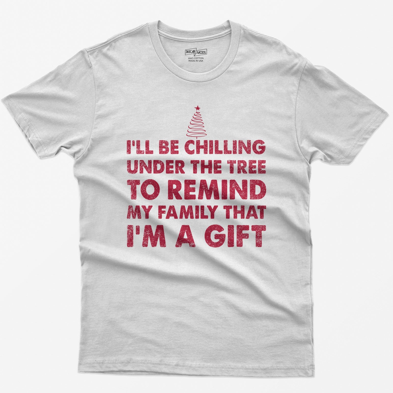 White t-shirt with I'll Be Chilling Under the Tree to Remind My Family That I'm a Gift in white letters and a small tree