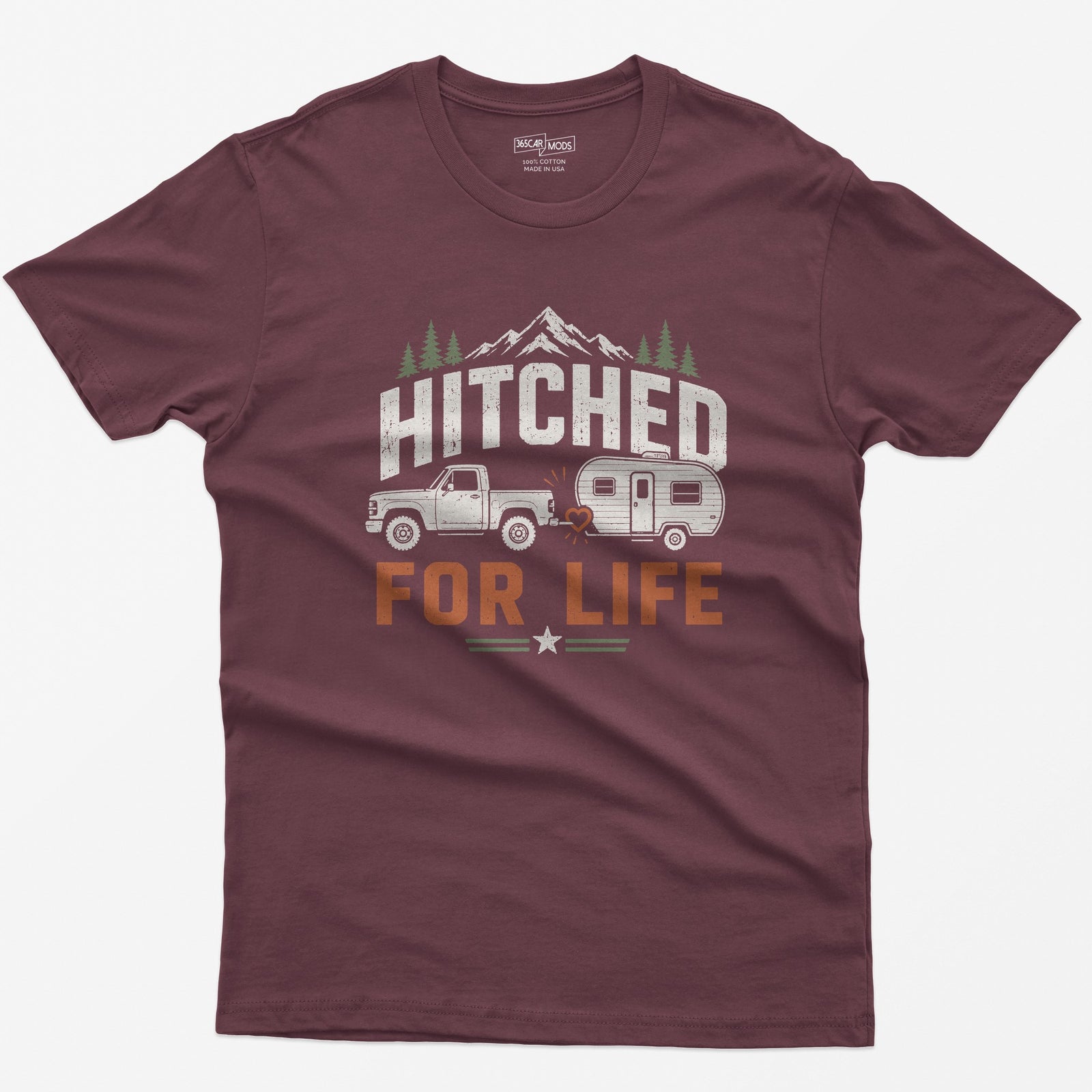 Maroon t-shirt with Hitched For Life, a pickup towing a travel trailer joined by a heart-shaped hitch, mountains and pines