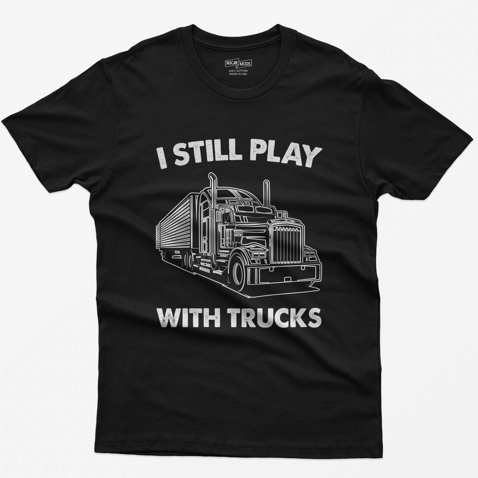 Black t-shirt with I Still Play With Trucks text and a white line drawing of a long-nose semi truck with trailer