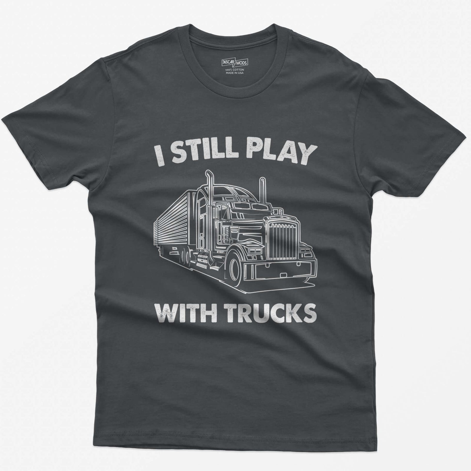 Charcoal t-shirt with I Still Play With Trucks text and a white line drawing of a long-nose semi truck with trailer