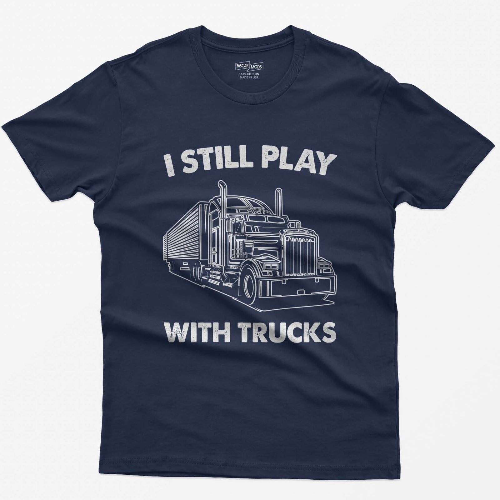 Navy t-shirt with I Still Play With Trucks text and a white line drawing of a long-nose semi truck with trailer