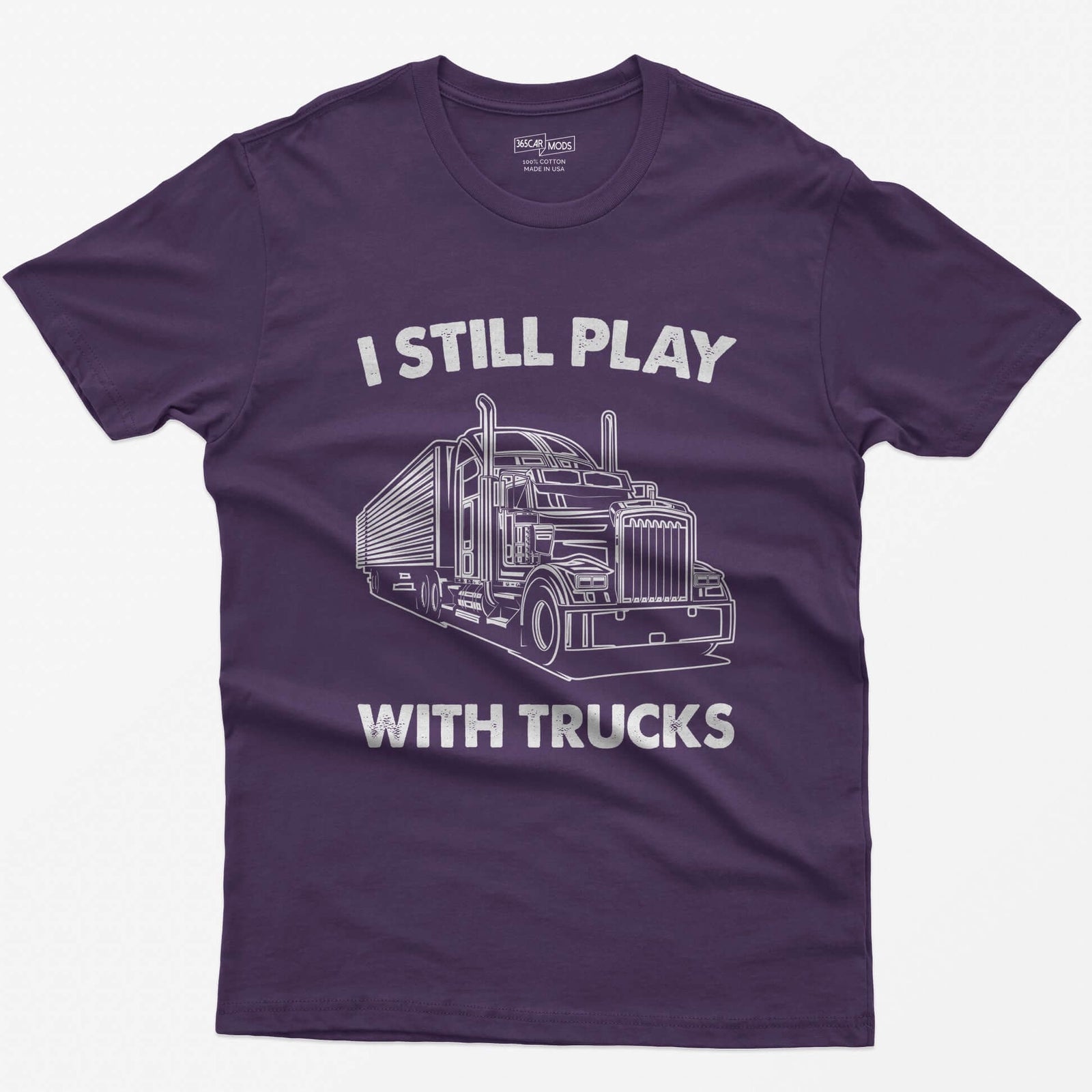 Purple t-shirt with I Still Play With Trucks text and a white line drawing of a long-nose semi truck with trailer