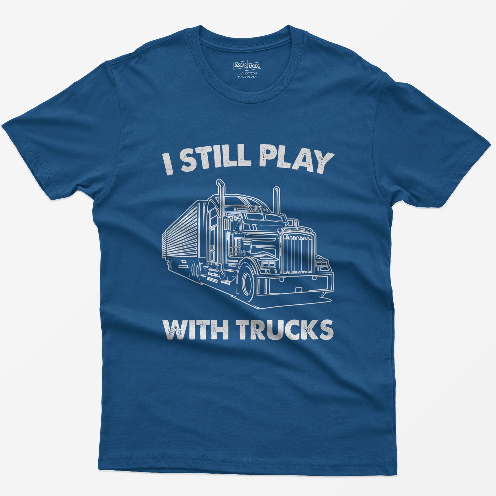 Royal t-shirt with I Still Play With Trucks text and a white line drawing of a long-nose semi truck with trailer