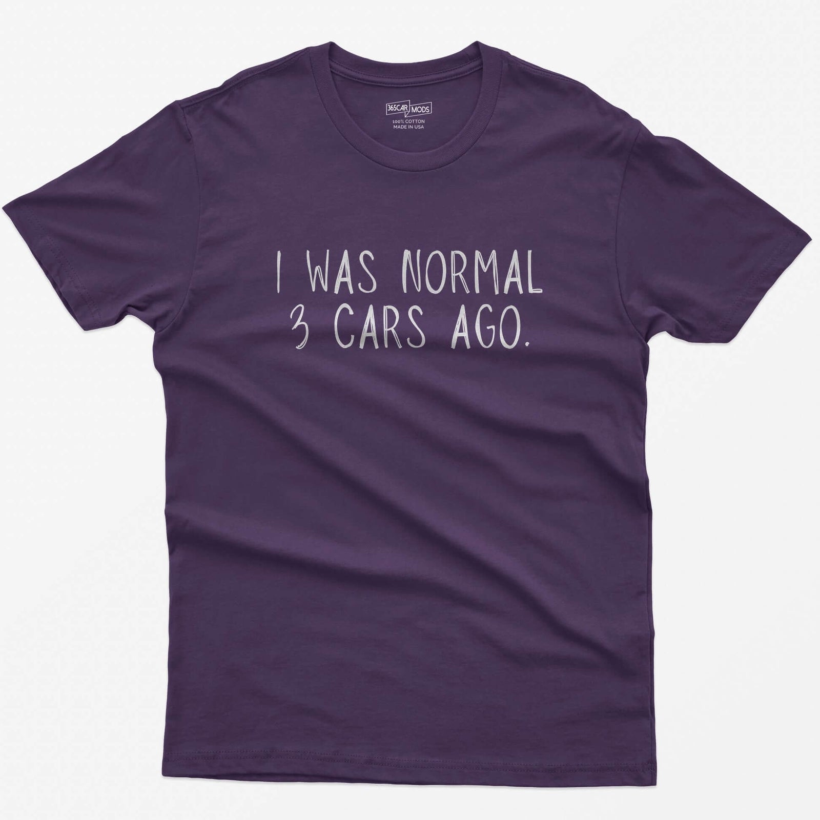 Purple t-shirt with thin hand-lettered white text reading I Was Normal 3 Cars Ago