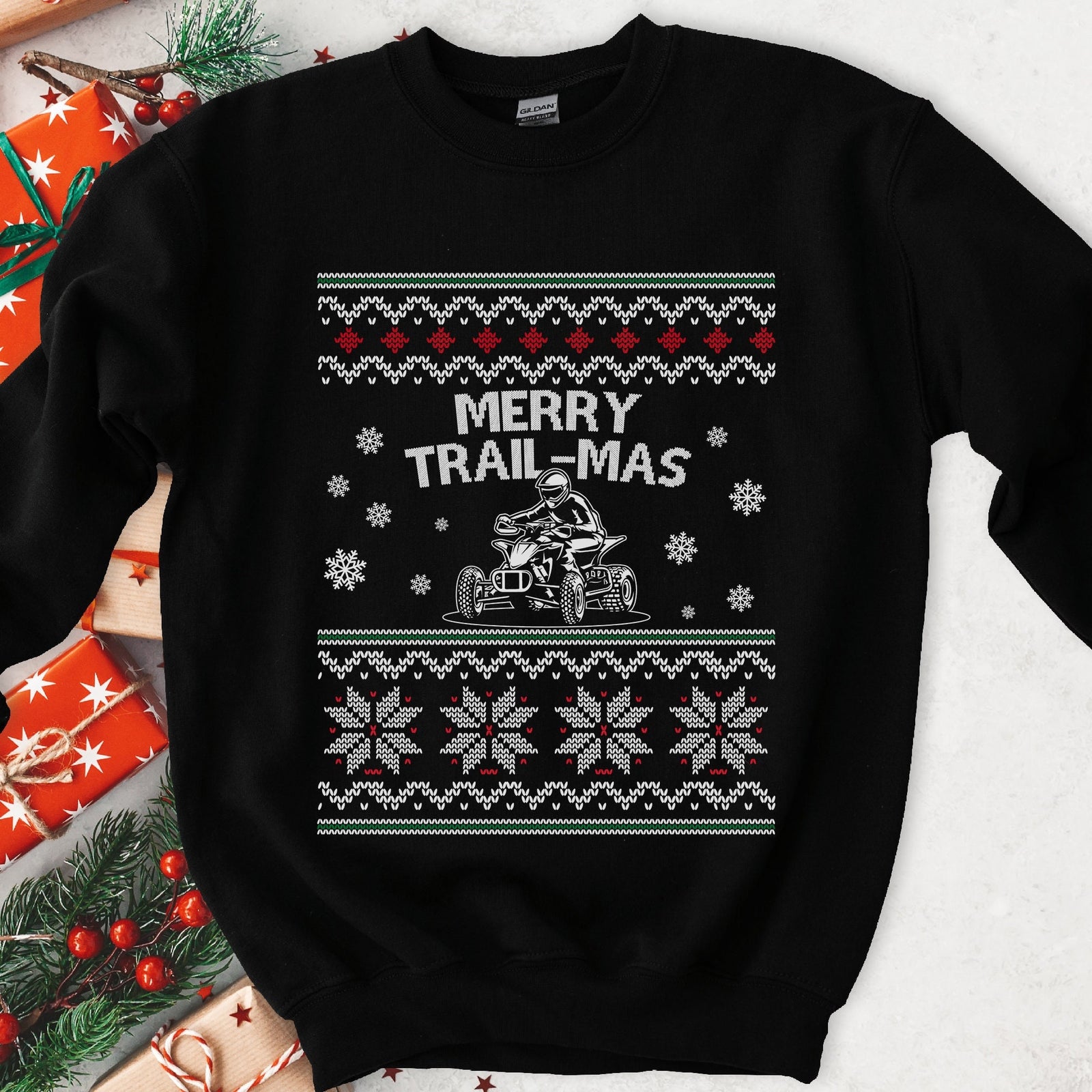 Dark Christmas sweatshirt with a rider on a sport quad under MERRY TRAIL-MAS, snowflake knit sweater bands