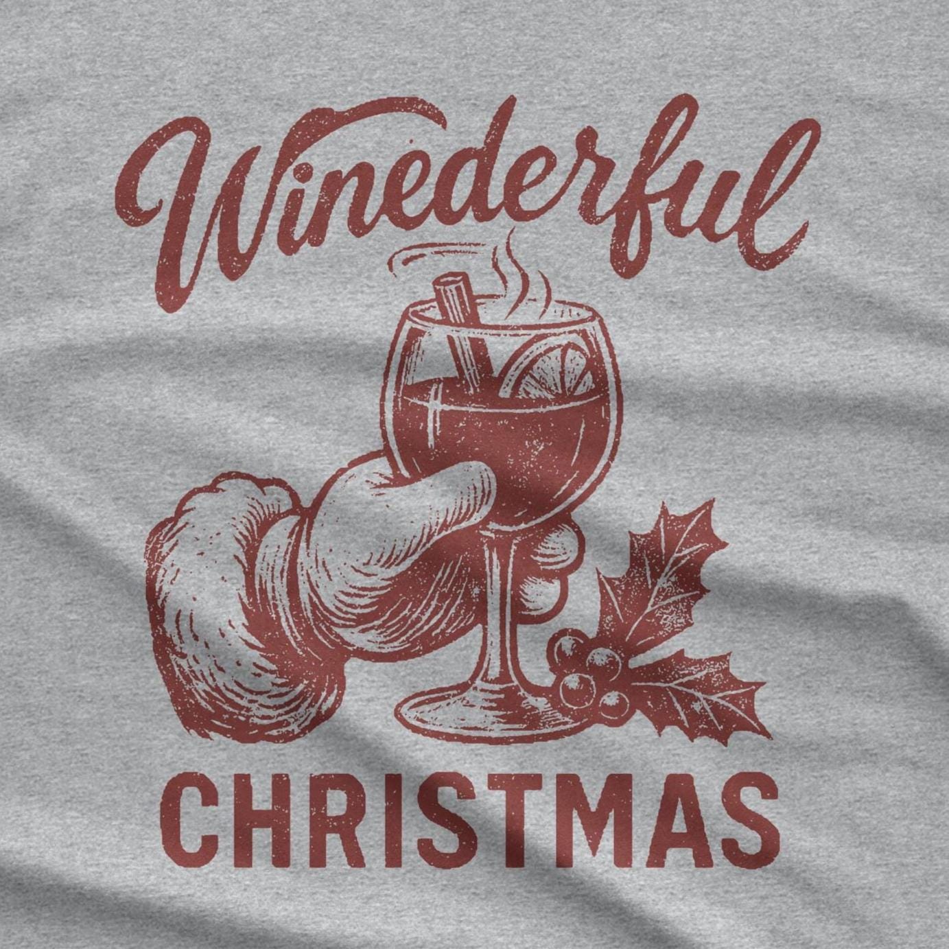 A red graphic on a gray background features the word "Winederful" above a drawing of a hand holding a wine glass filled with a warm beverage. The glass contains a cinnamon stick and orange slice.