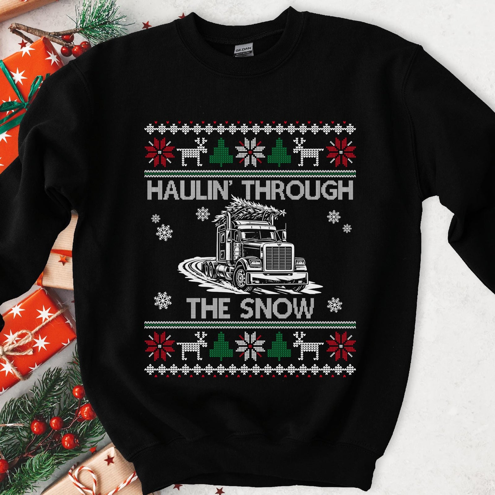 Dark Christmas sweatshirt with a semi truck hauling a tree through snow, HAULIN' THROUGH THE SNOW, knit borders