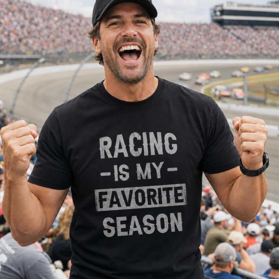 Athletic man wearing a black “Racing Is My Favorite Season” T-shirt while cheering in the grandstands at a stock car race.