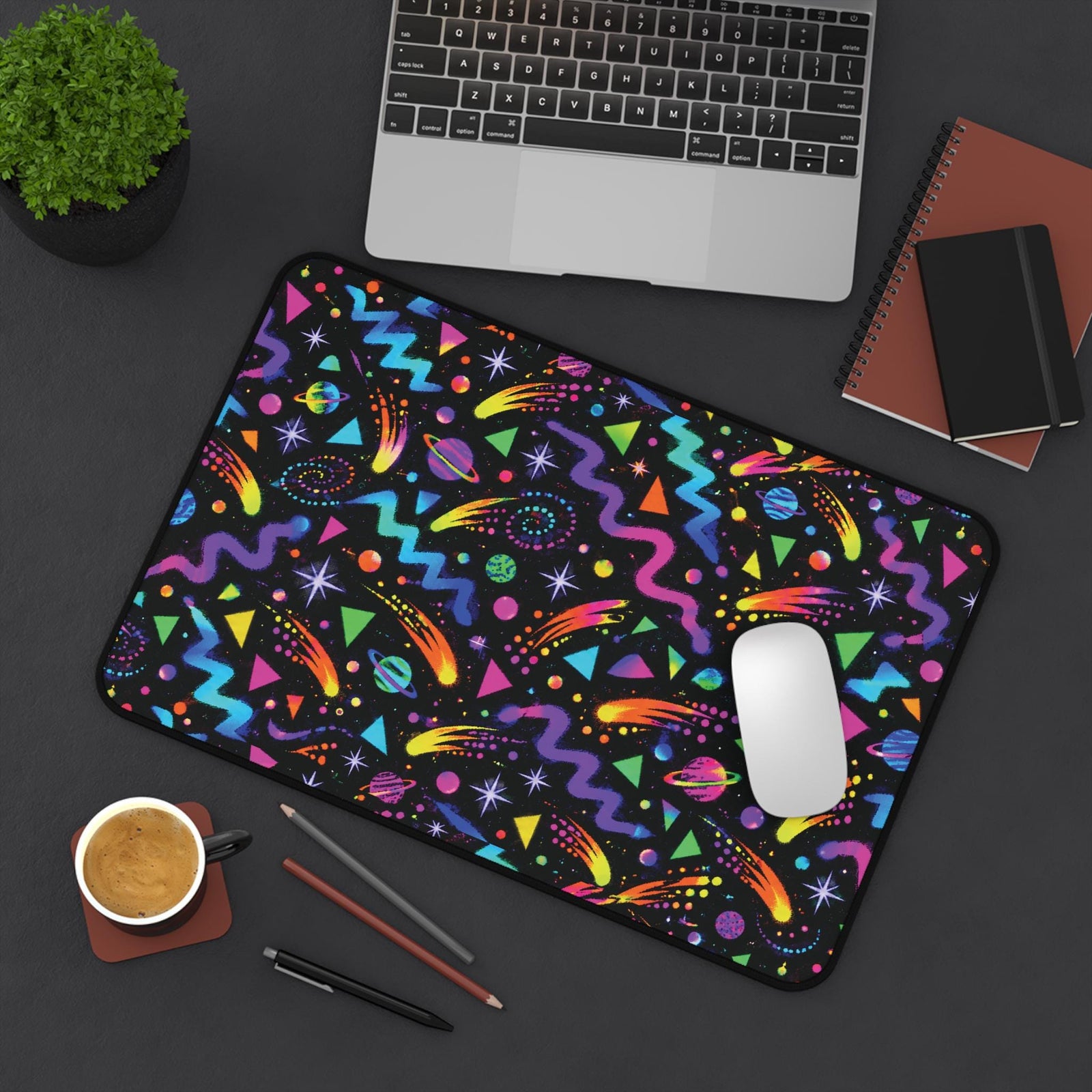 Small arcade carpet mouse pad on a dark desk, top view