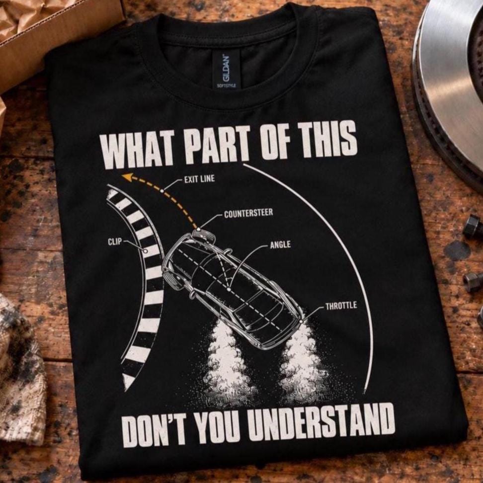Black What Part Of This Don't You Understand drifting t-shirt folded on a garage workbench