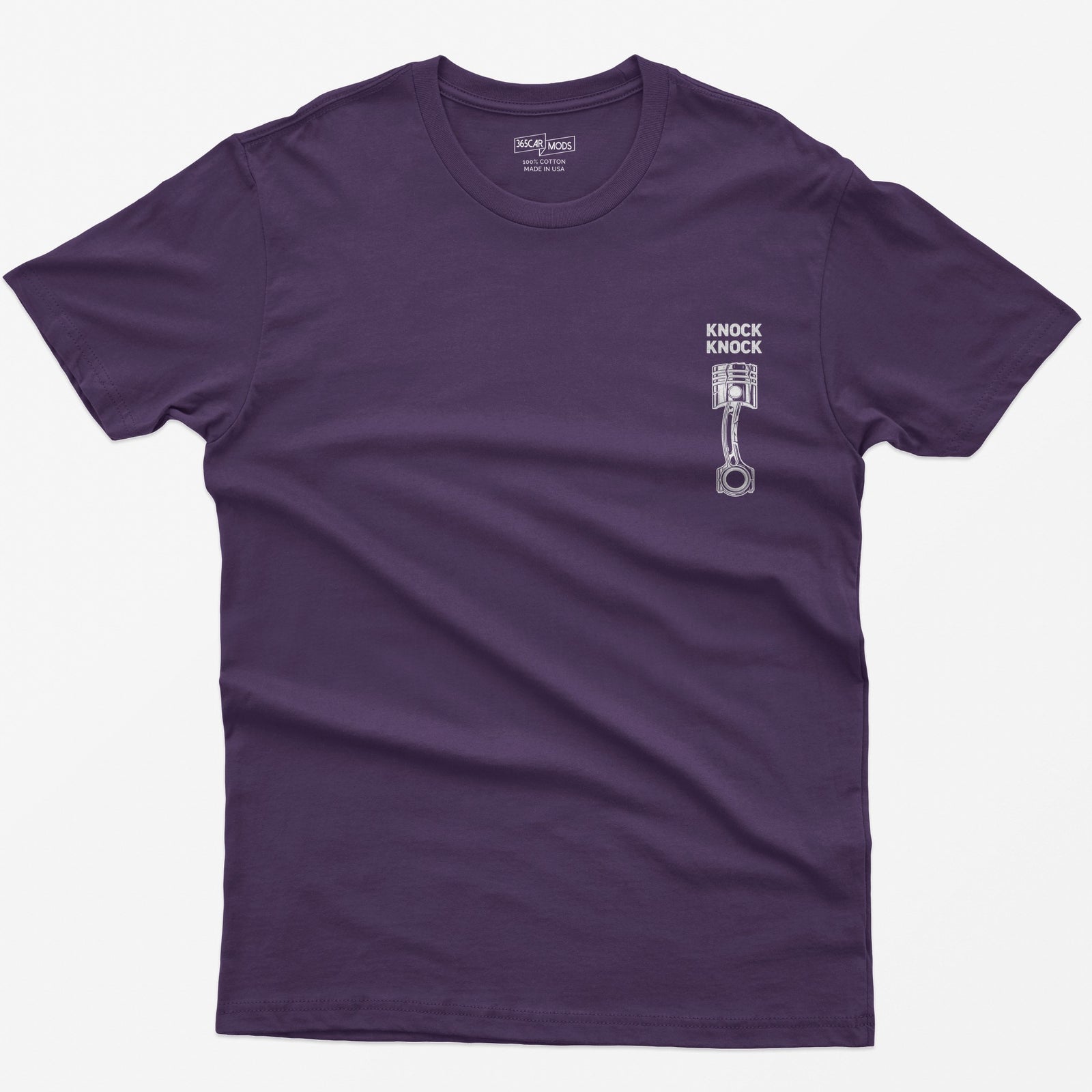 Purple t-shirt with Knock Knock text above a white line-art piston and connecting rod with a damaged crown