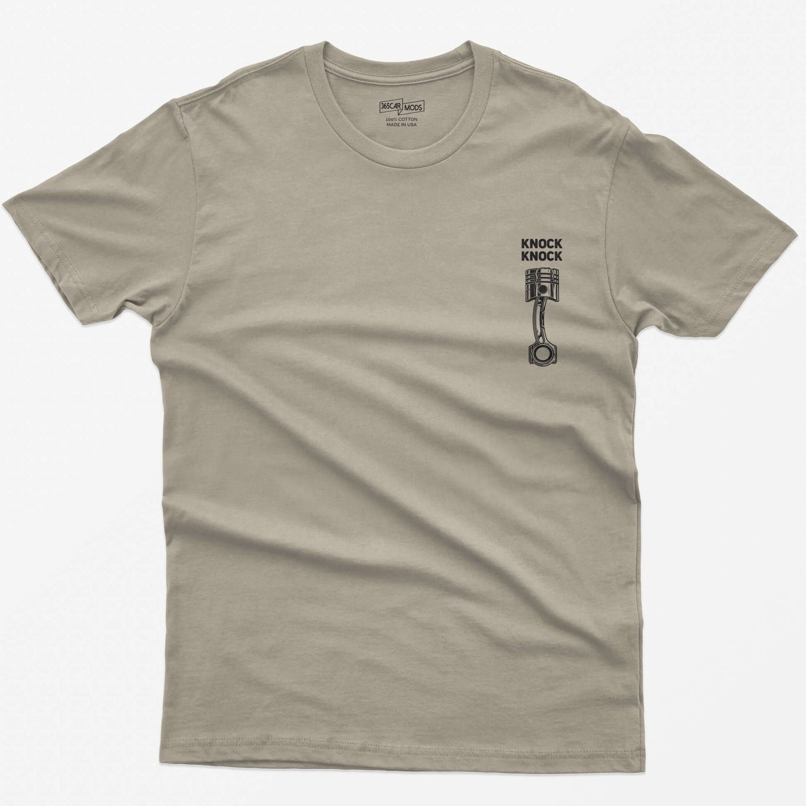 Sand t-shirt with Knock Knock text above a white line-art piston and connecting rod with a damaged crown