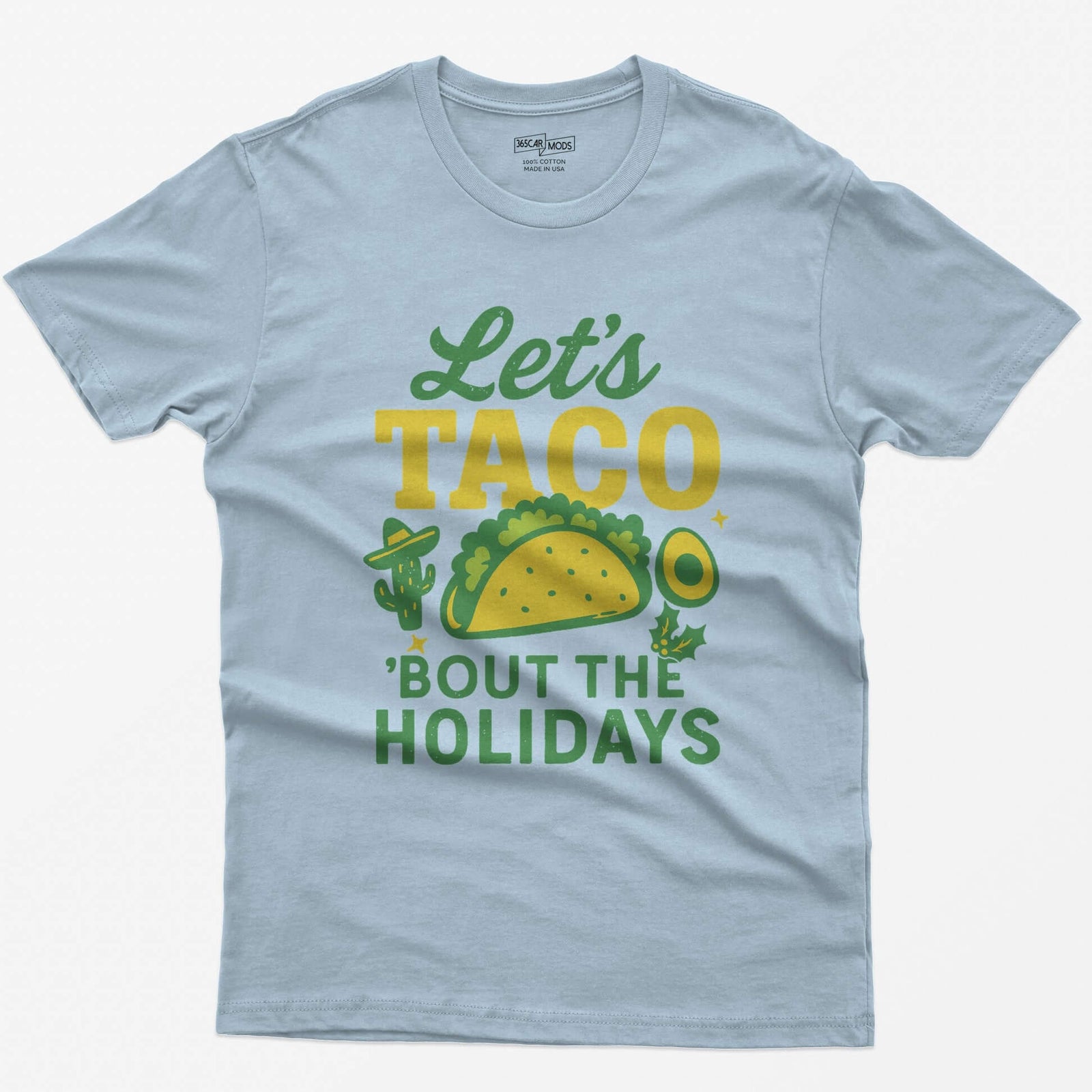 Light Blue t-shirt with Let's Taco Bout The Holidays in green and yellow, with a taco, a cactus in a sombrero, avocado and holly