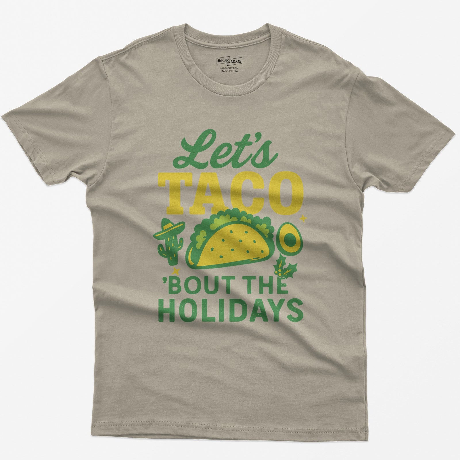 Sand t-shirt with Let's Taco Bout The Holidays in green and yellow, with a taco, a cactus in a sombrero, avocado and holly