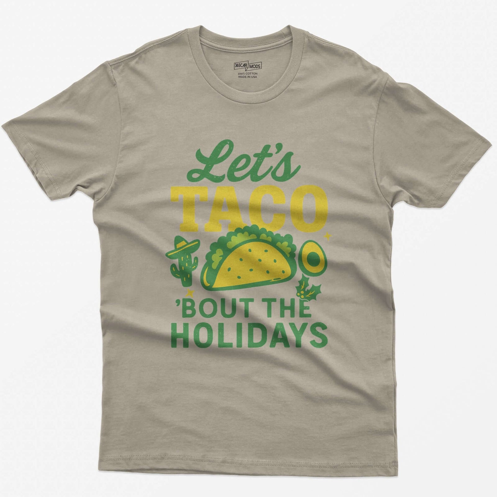 Sand t-shirt with Let's Taco Bout The Holidays in green and yellow, with a taco, a cactus in a sombrero, avocado and holly