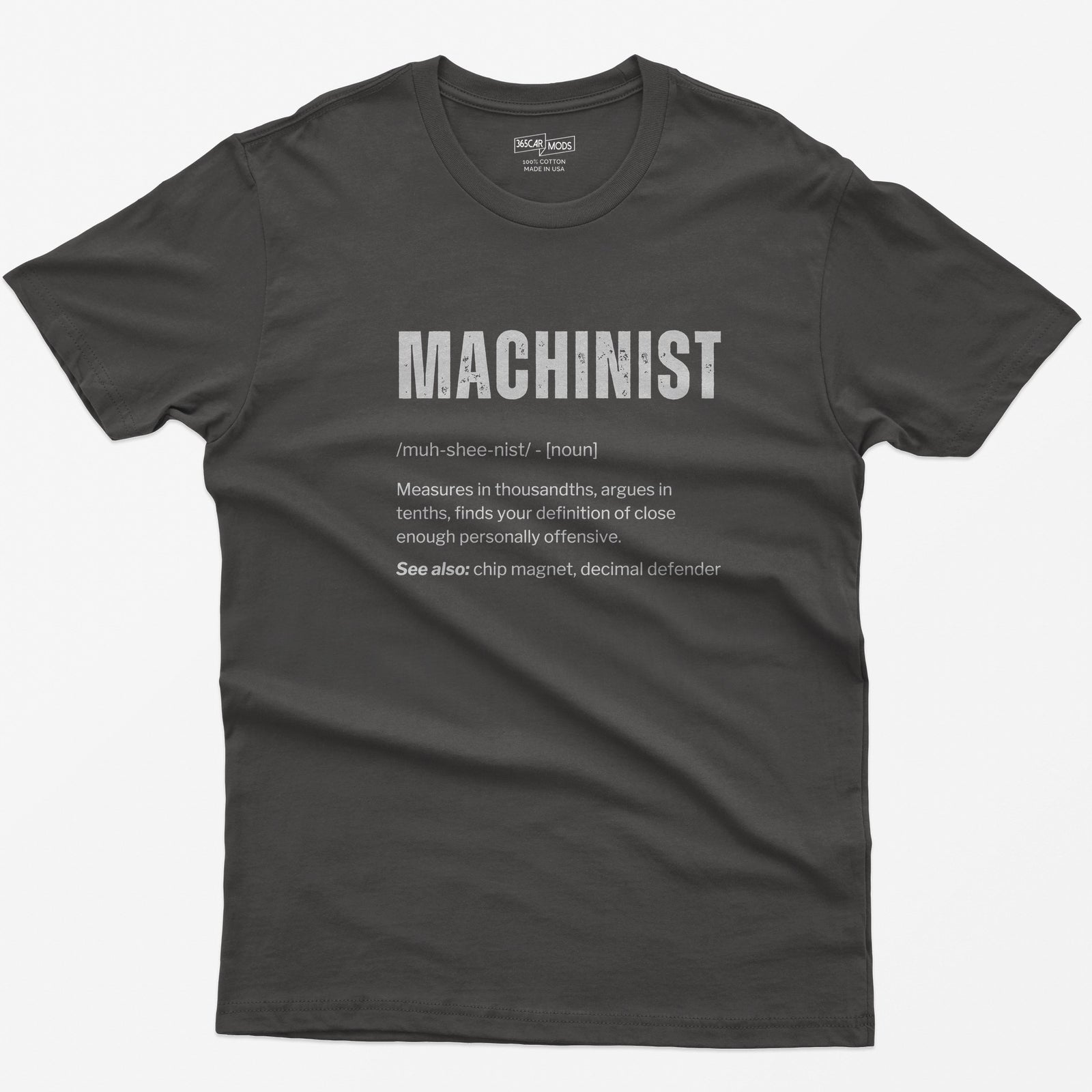 Dark Heather t-shirt with a Machinist dictionary definition: measures in thousandths, argues in tenths, see also chip magnet