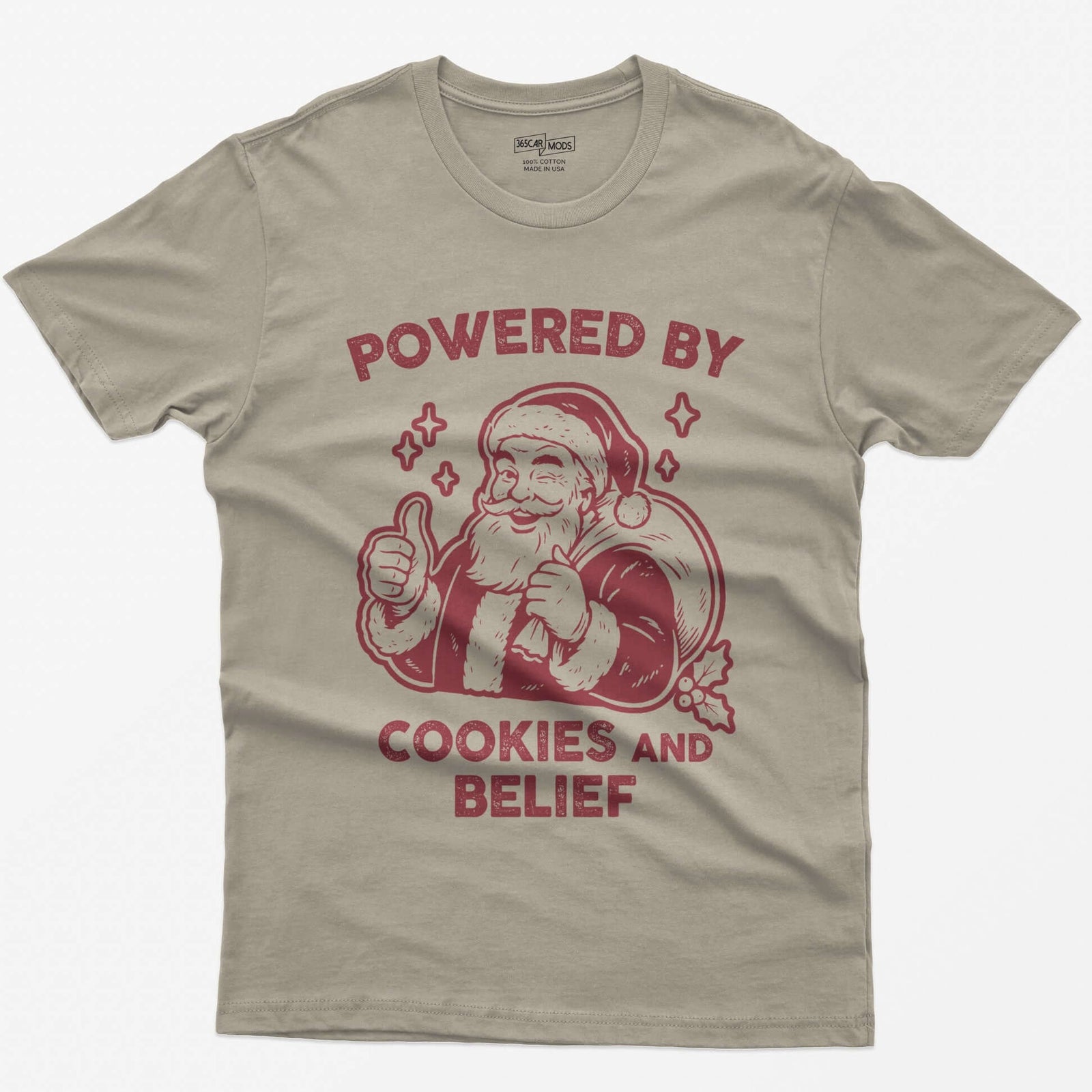 Sand t-shirt with vintage white print of a winking Santa giving a thumbs up and the words Powered by Cookies and Belief