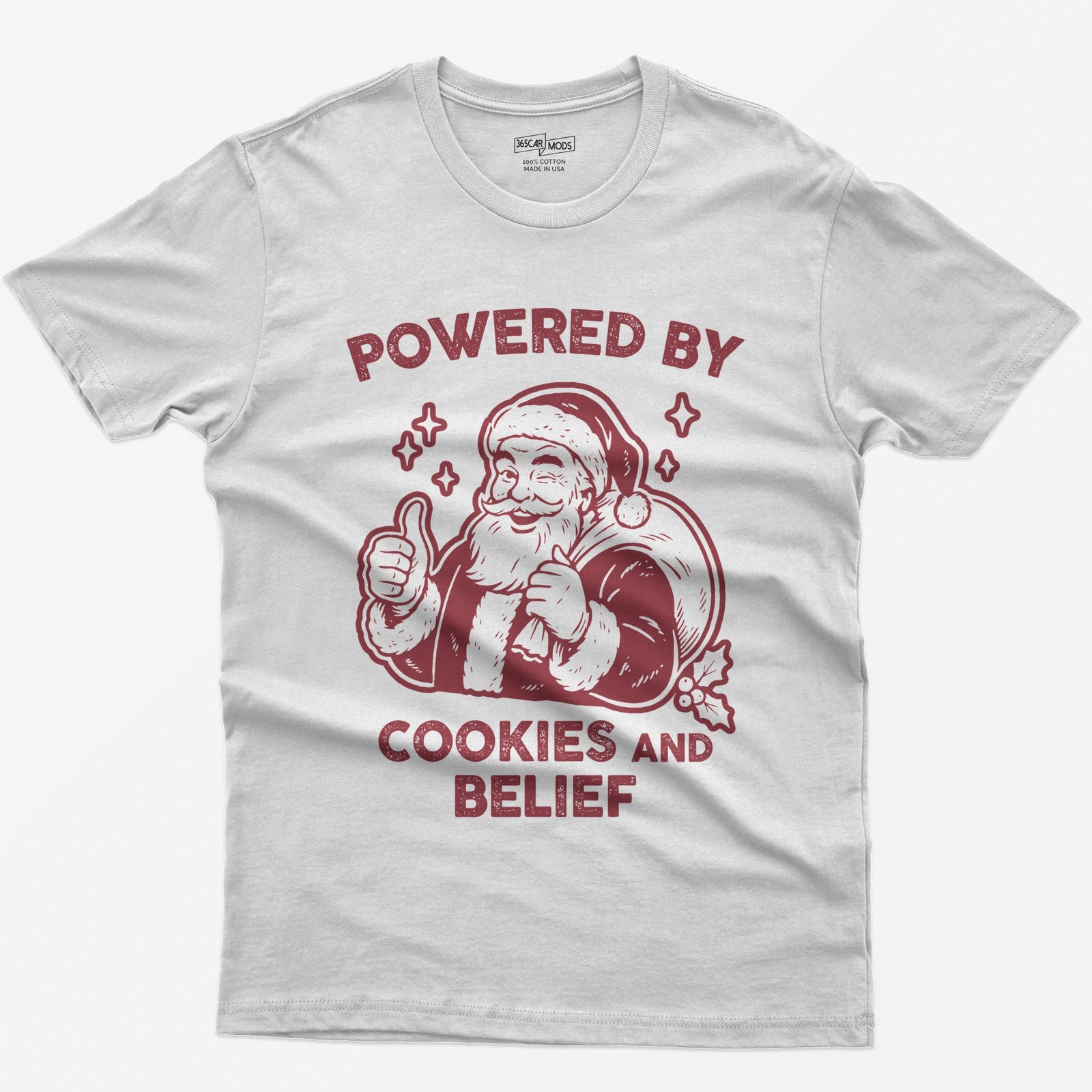 White t-shirt with vintage white print of a winking Santa giving a thumbs up and the words Powered by Cookies and Belief