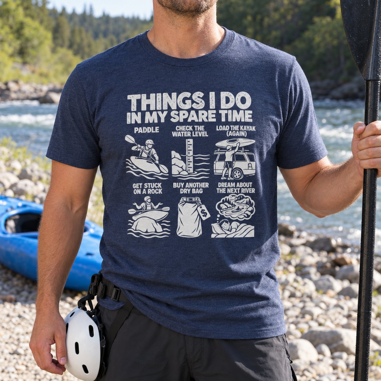 Kayaker in the heather navy spare time t-shirt holding a paddle on a river bank