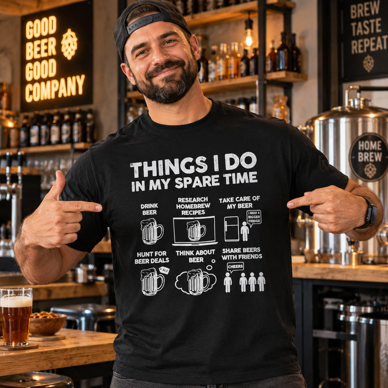 Man wearing the black Things I Do in My Spare Time beer t-shirt in a home bar