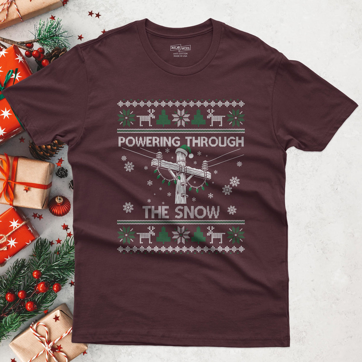 Powering Through the Snow Lineman Christmas T-Shirt in Maroon