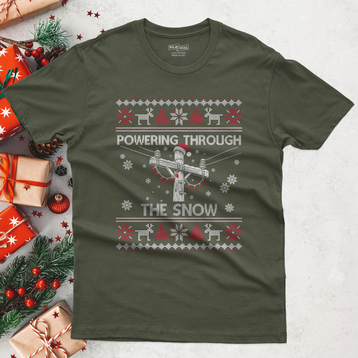 Powering Through the Snow Lineman Christmas T-Shirt in Military Green
