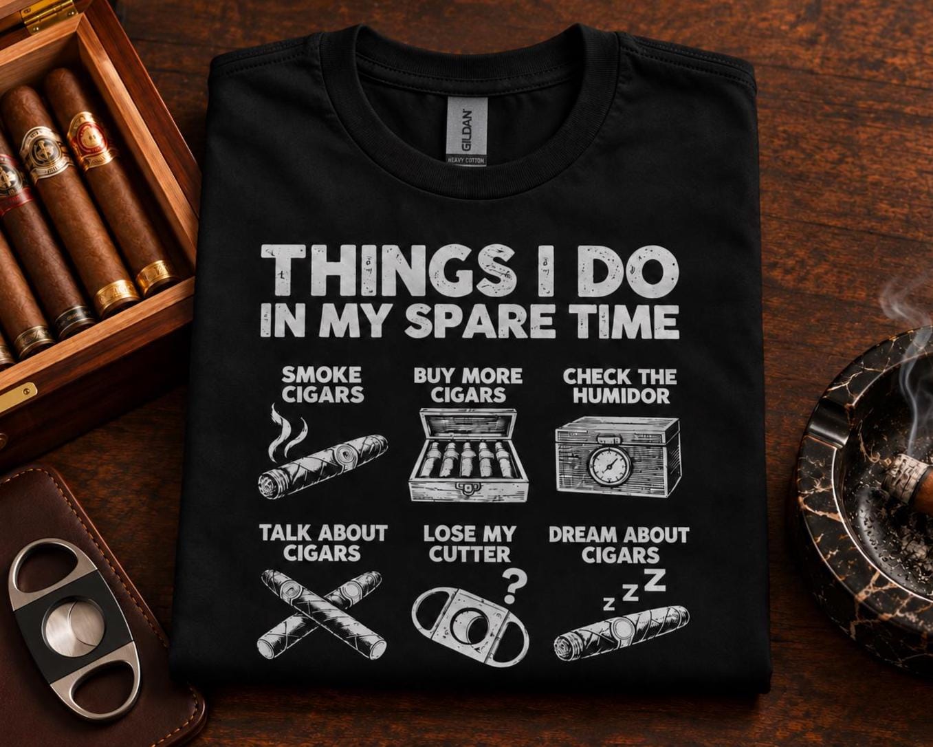 Things I Do In My Spare Time Cigar T-Shirt - black t-shirt folded next to a box of cigars and a cutter