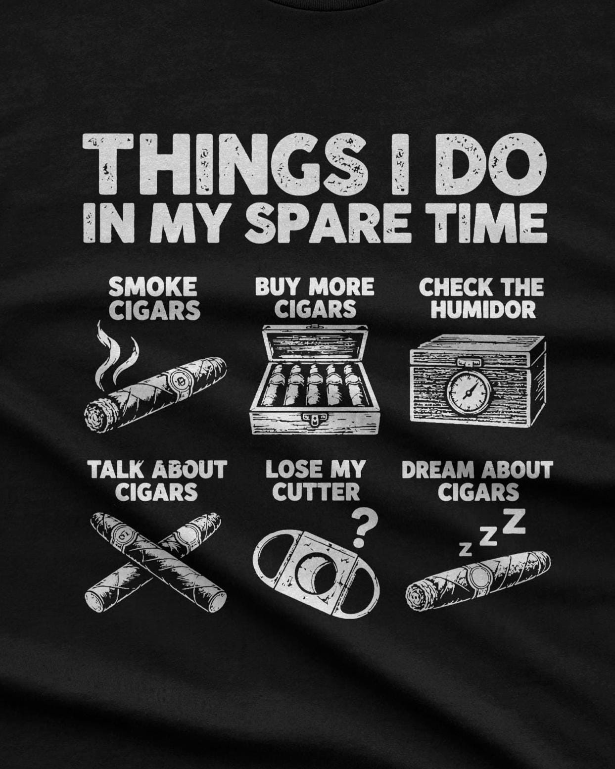 Things I Do In My Spare Time Cigar T-Shirt - black t-shirt folded next to a box of cigars and a cutter