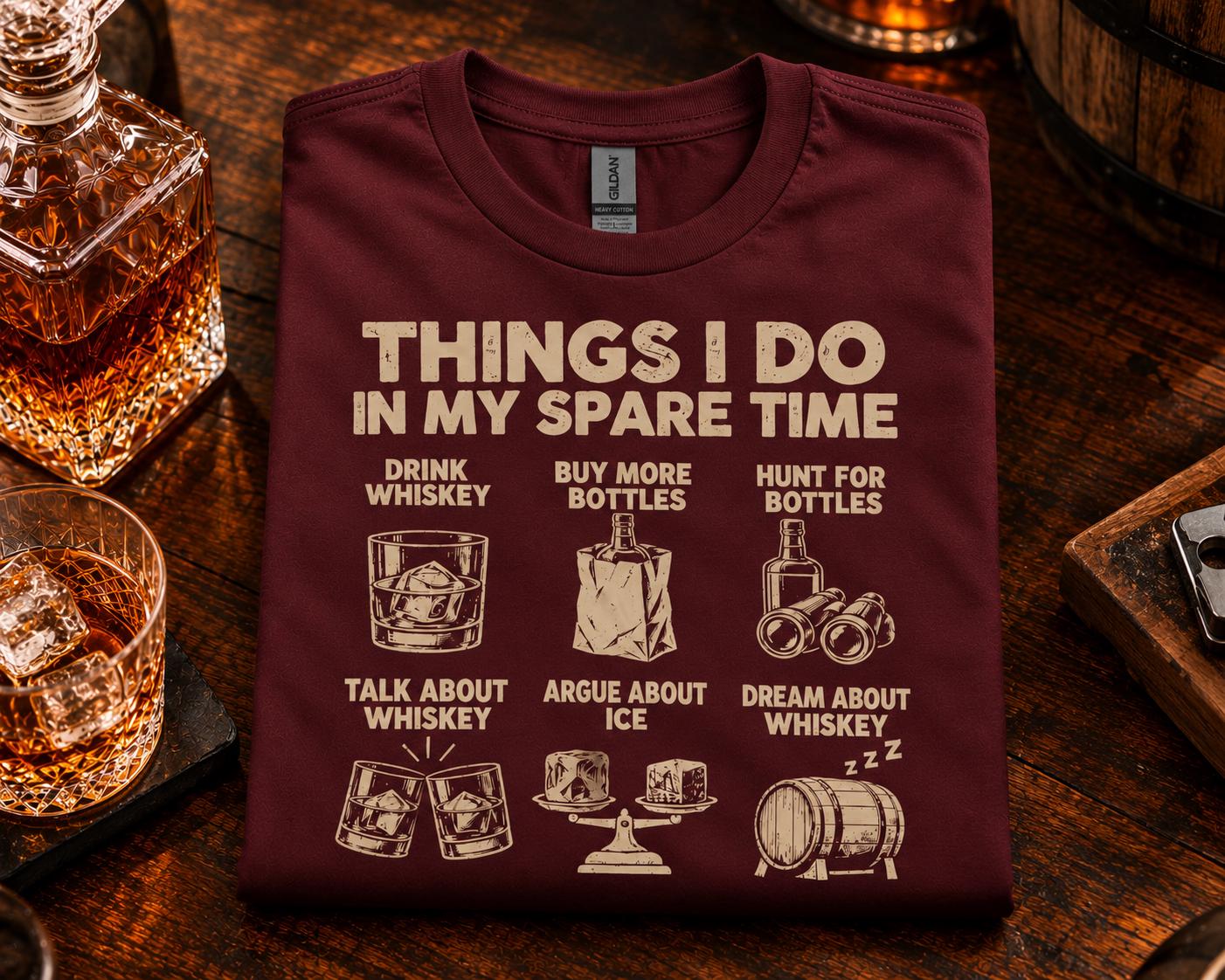 Things I Do In My Spare Time Whiskey T-Shirt - maroon t-shirt folded on a bar with a decanter and whiskey glasses