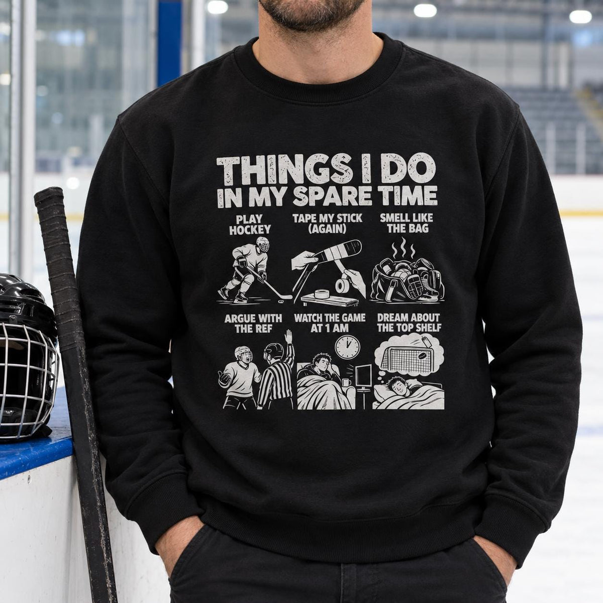 Hockey player in the black Things I Do In My Spare Time hockey sweatshirt at the rink with his stick