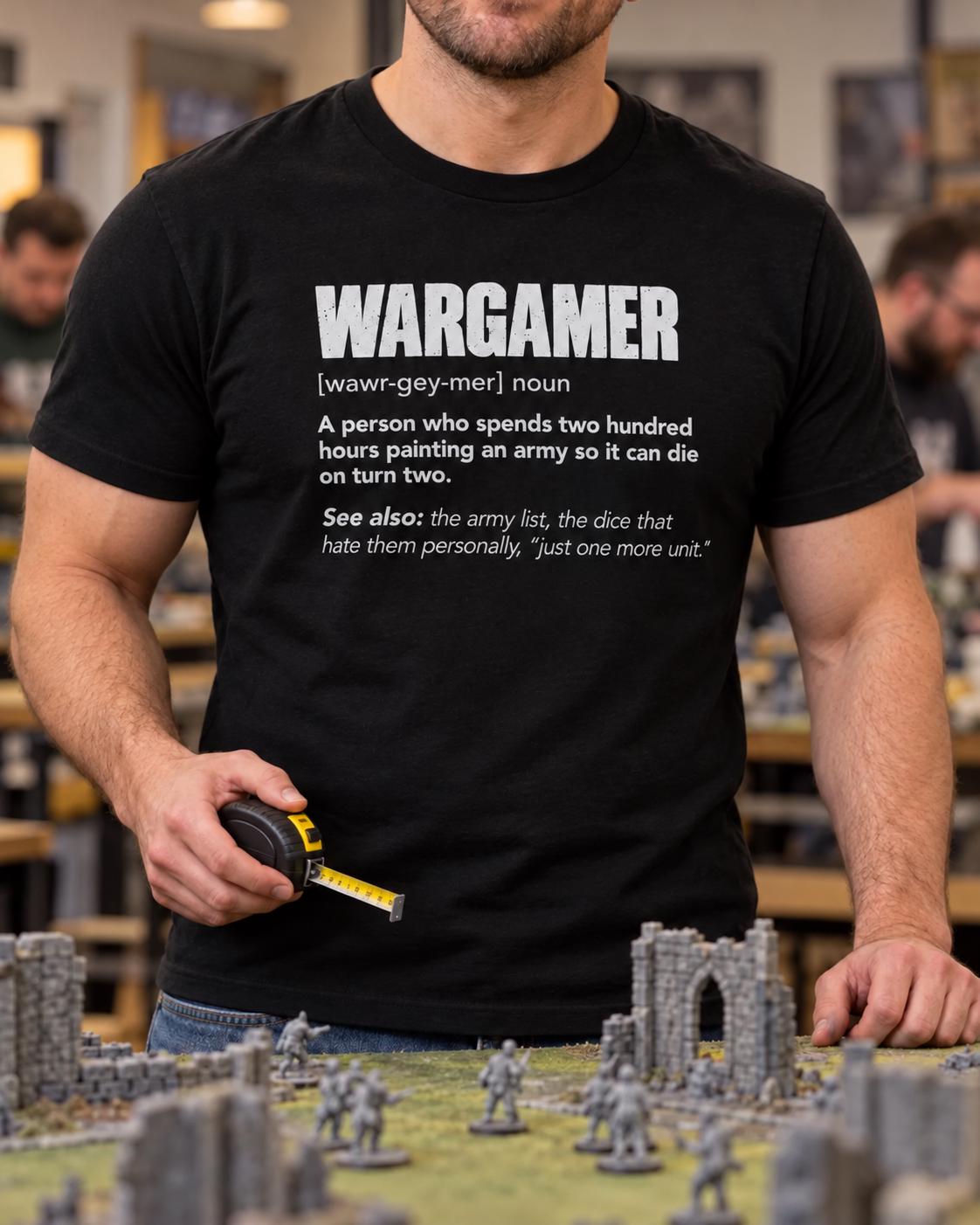 Wargamer Definition T-Shirt - man in the black t-shirt measuring on a wargaming table