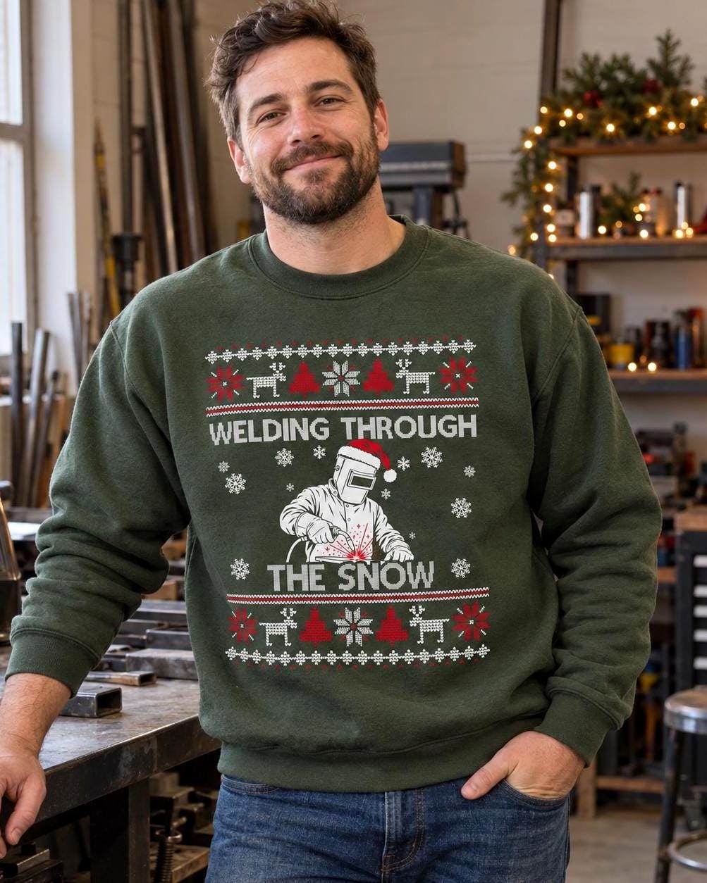 Welding Through the Snow Welder Christmas Sweatshirt - black crewneck, welder in a hood and Santa hat with sparks