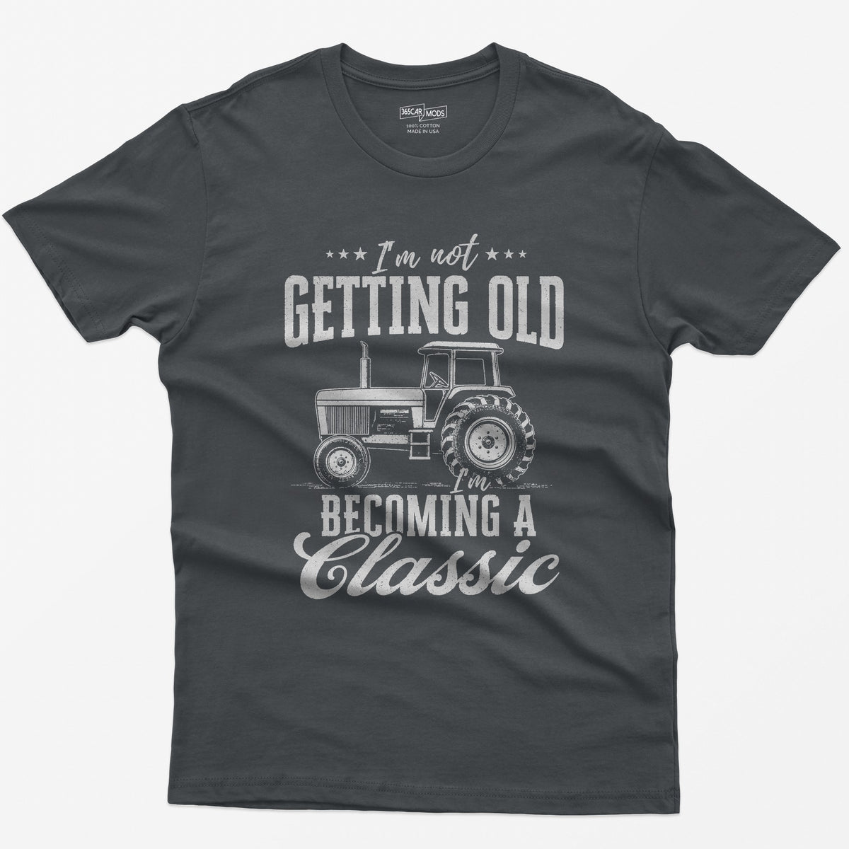 Charcoal t-shirt with I'm Not Getting Old I'm Becoming a Classic in distressed white print around a vintage cab tractor
