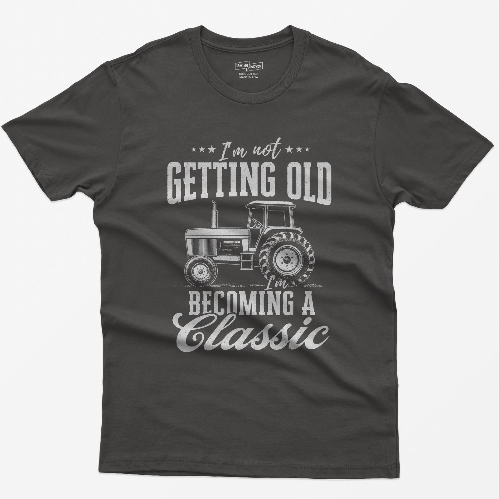 Dark Heather t-shirt with I'm Not Getting Old I'm Becoming a Classic in distressed white print around a vintage cab tractor