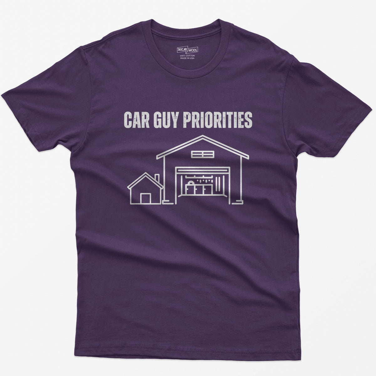 Purple t-shirt with Car Guy Priorities and a line drawing of a tiny house beside a huge garage with a car on a lift