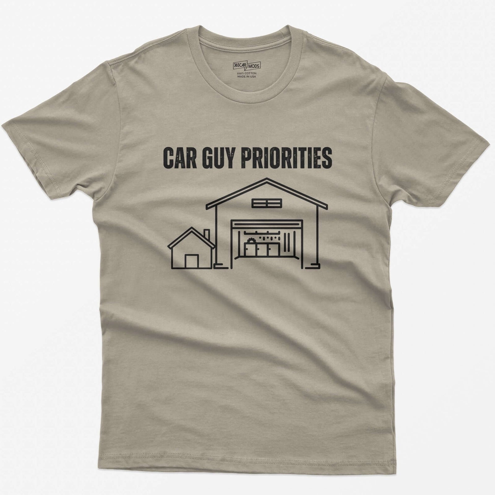 Sand t-shirt with Car Guy Priorities and a line drawing of a tiny house beside a huge garage with a car on a lift