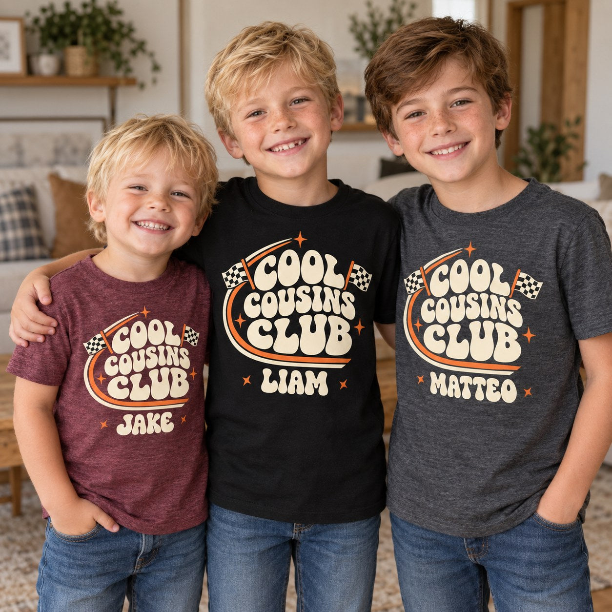 Three young cousins in personalized Cool Cousins Club t-shirts in maroon, black and grey