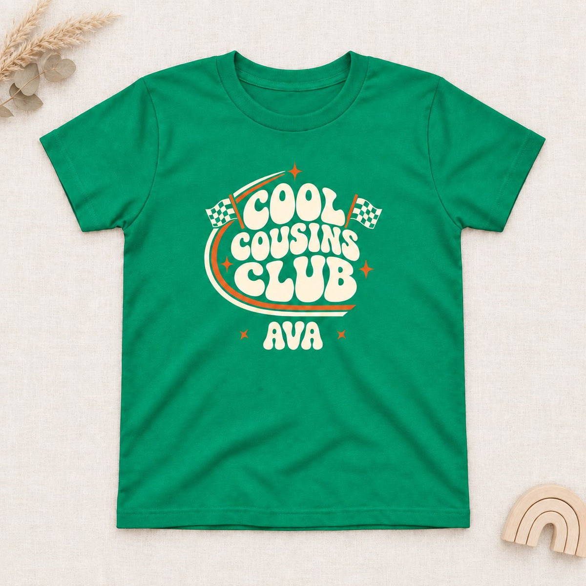Irish Green t-shirt with a personalized Cool Cousins Club print with racing flags and a first name