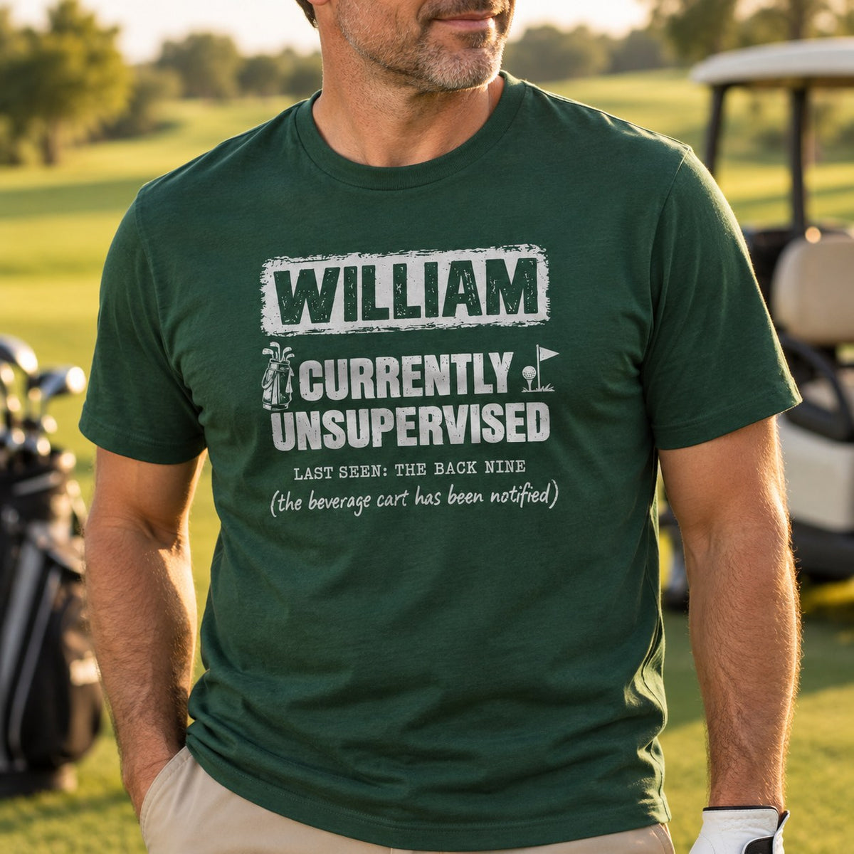Man wearing the forest green personalized Currently Unsupervised golf t-shirt on the golf course