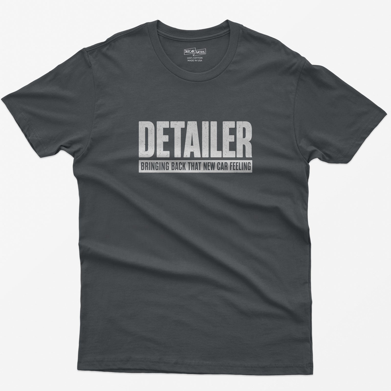 Charcoal t-shirt with Detailer in huge distressed letters and Bringing Back That New Car Feeling in a bar below
