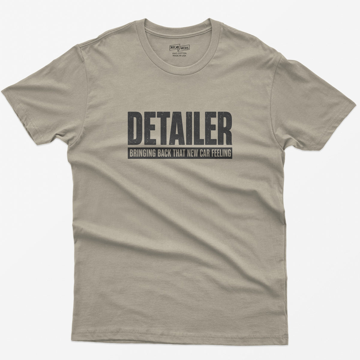 Sand t-shirt with Detailer in huge distressed letters and Bringing Back That New Car Feeling in a bar below
