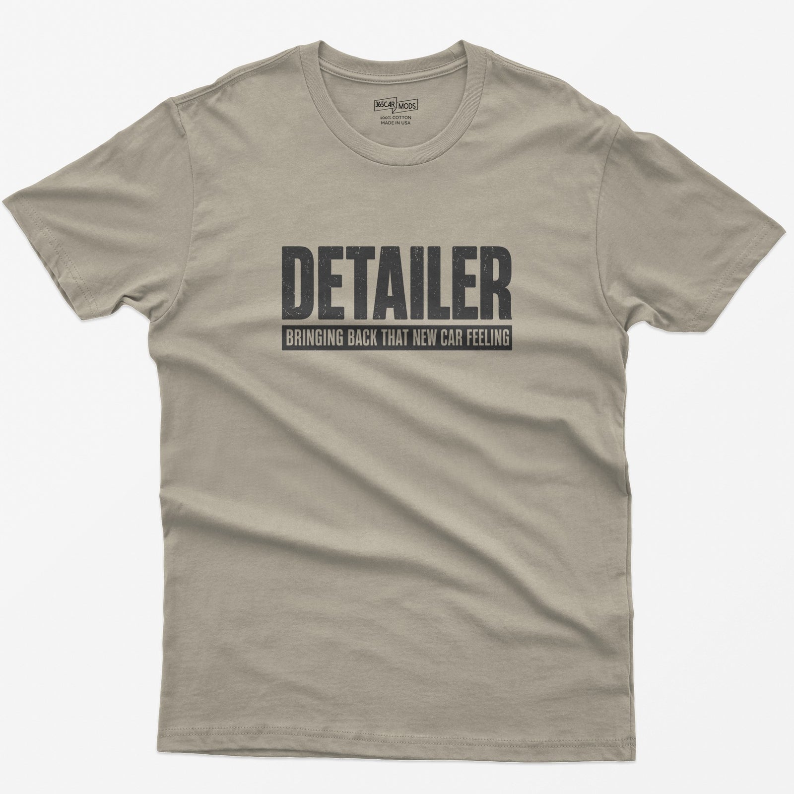 Sand t-shirt with Detailer in huge distressed letters and Bringing Back That New Car Feeling in a bar below