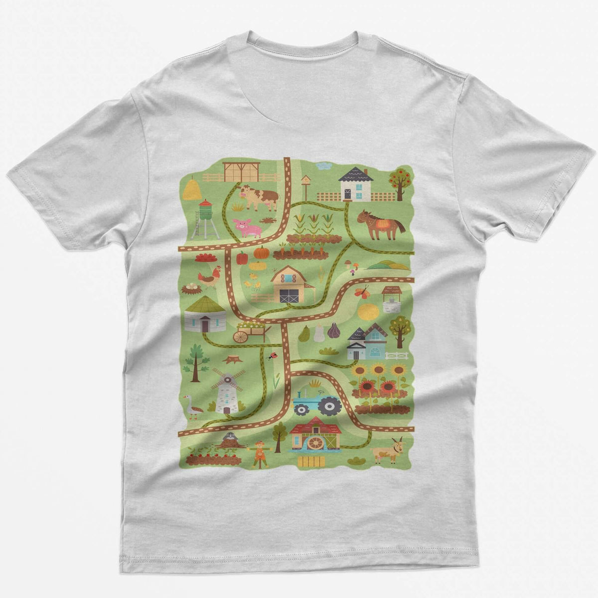 White t-shirt with a farm road play mat on the back: barn, tractor, windmill, sunflowers and animals on winding roads